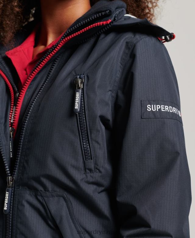 il Superdry נשים ז'קט מעיל רוח לוגו עם קפוצ'ון חיל הים 4LX2Z3830 הַלבָּשָׁה