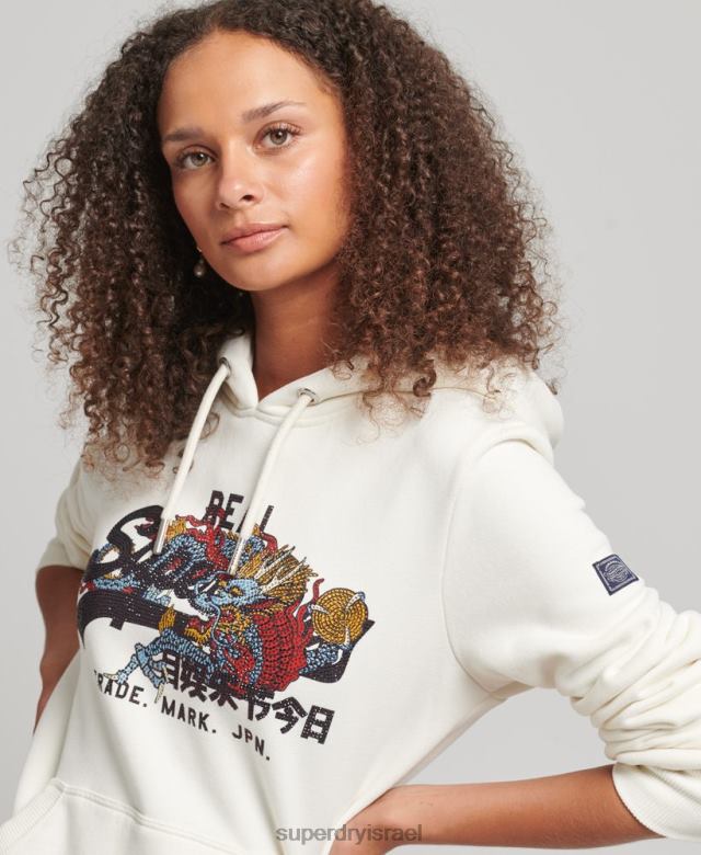 il Superdry נשים נרטיב לוגו וינטג' קפוצ'ון ריינסטון קרם 4LX2Z6083 הַלבָּשָׁה