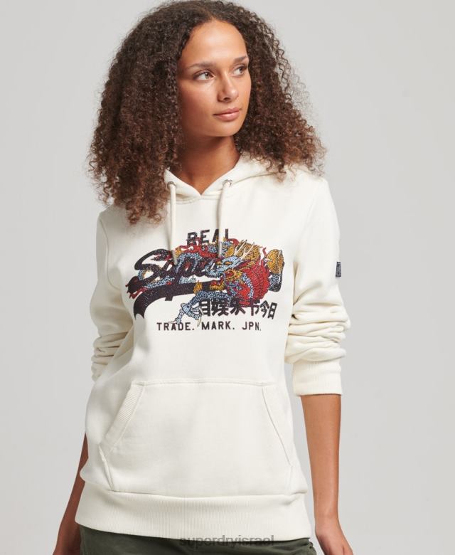 il Superdry נשים נרטיב לוגו וינטג' קפוצ'ון ריינסטון קרם 4LX2Z6083 הַלבָּשָׁה