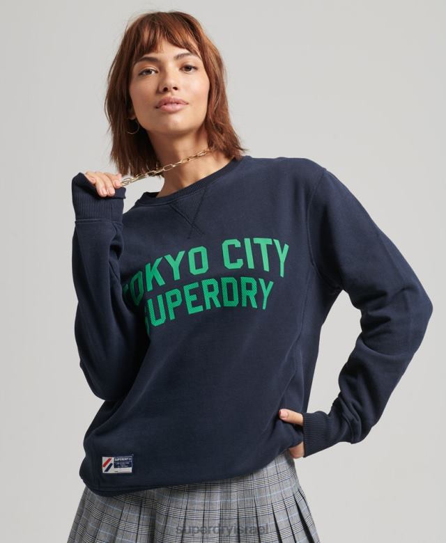 il Superdry נשים סווטשירט צוות אוברסייז גרפי מכללה חיל הים 4LX2Z6161 הַלבָּשָׁה