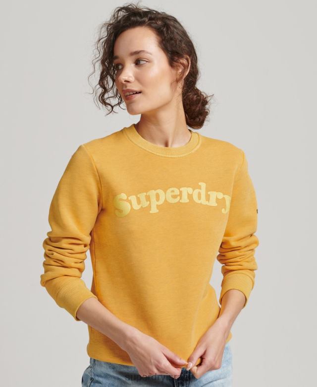 il Superdry נשים סווטשירט לוגו קלאסי משנות ה-70 של קופר זהב 4LX2Z5786 הַלבָּשָׁה